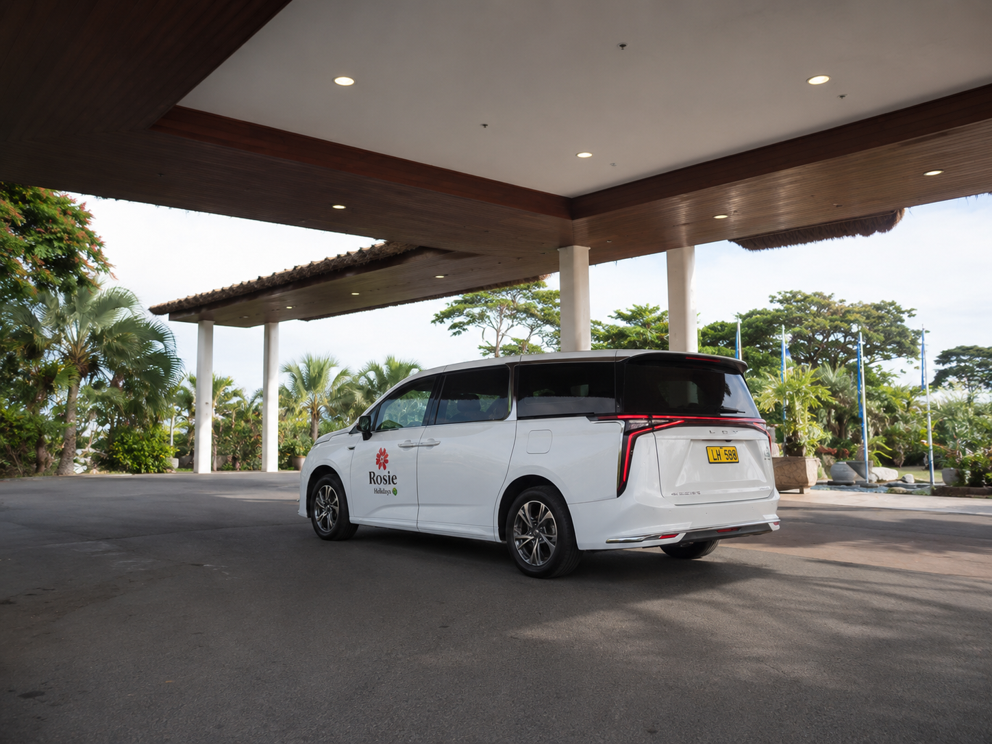 White electric van at Hilton Fiji resort entrance